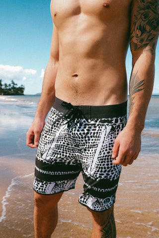 Leopard cone shell board shorts