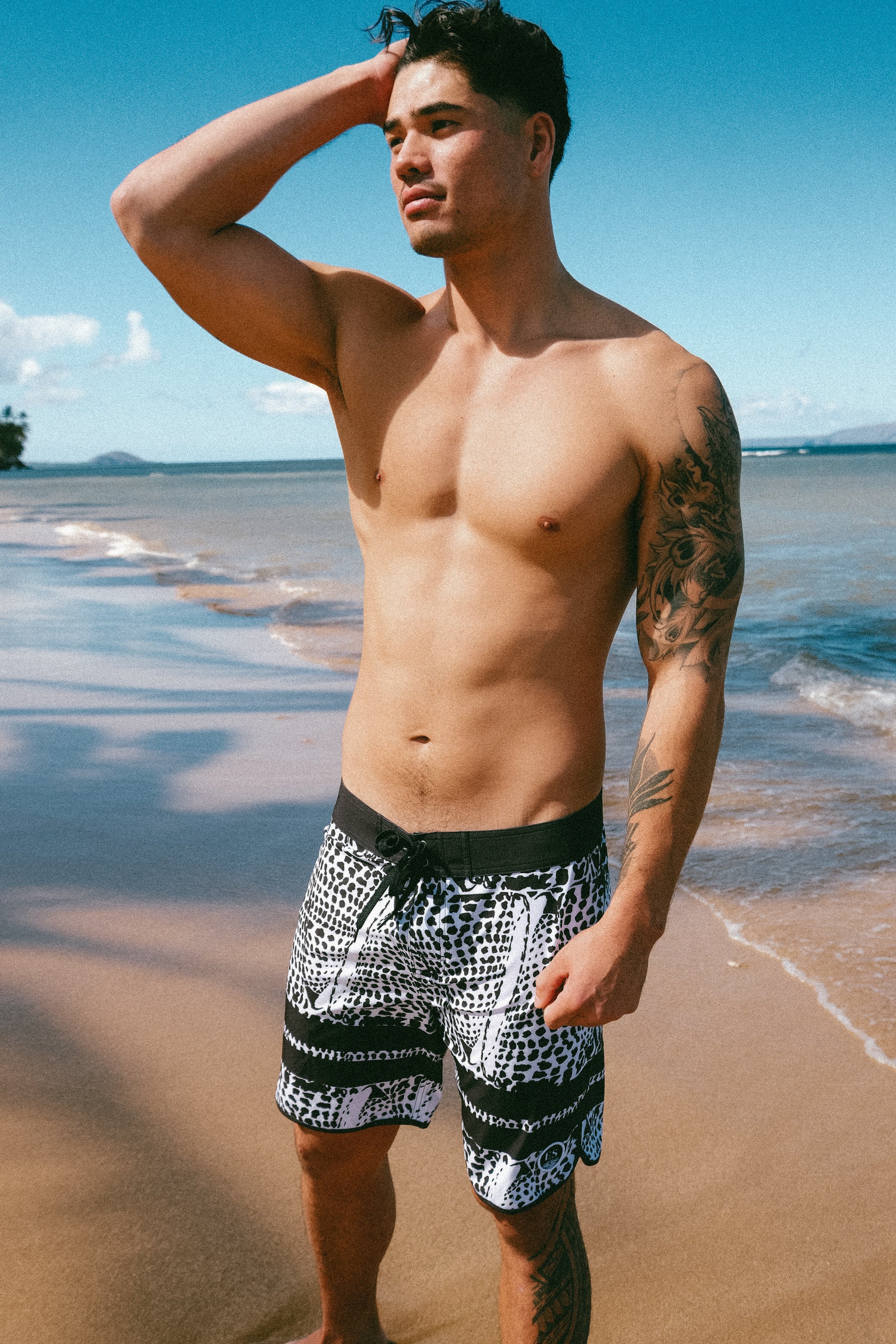 Leopard cone shell board shorts