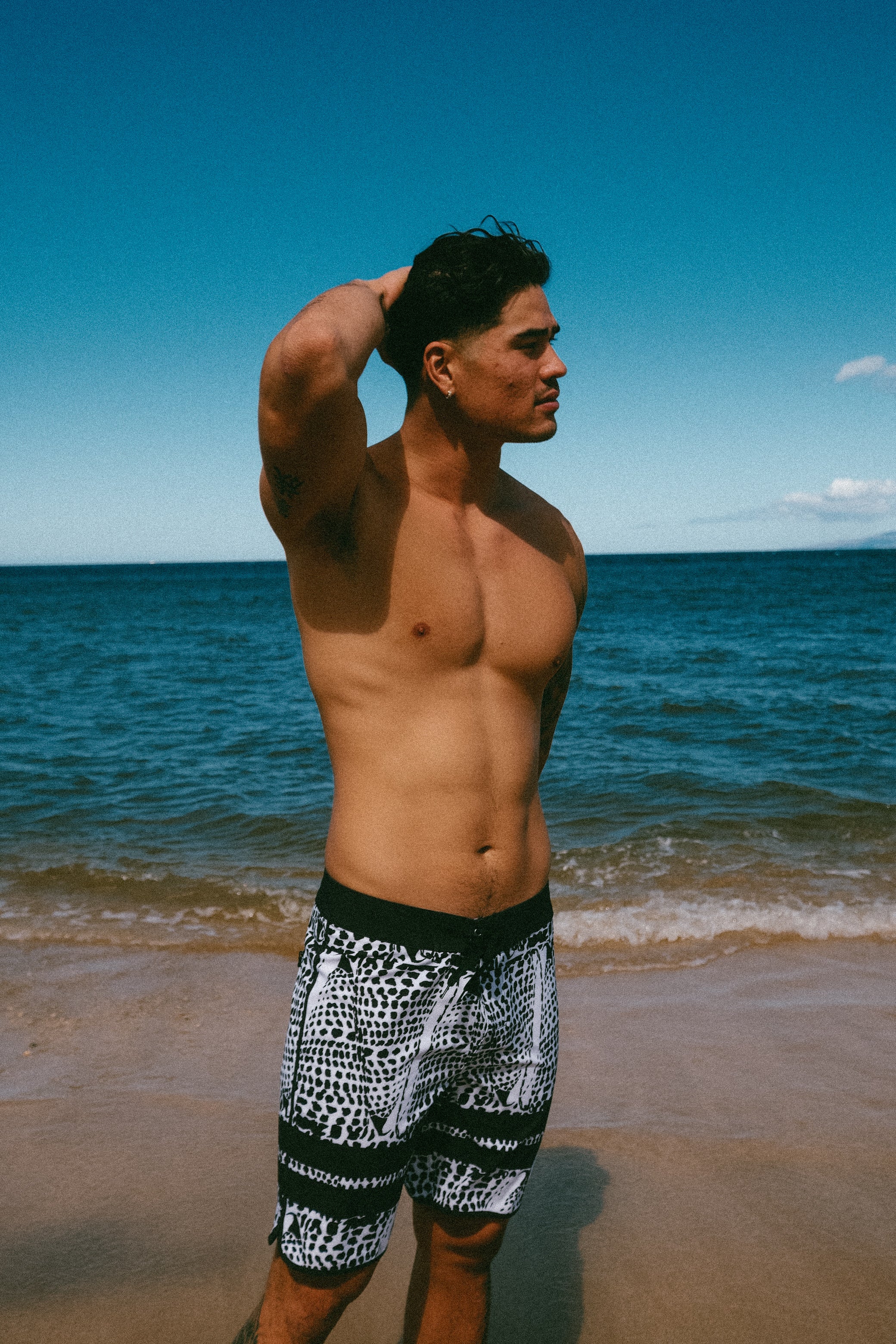 Leopard cone shell board shorts